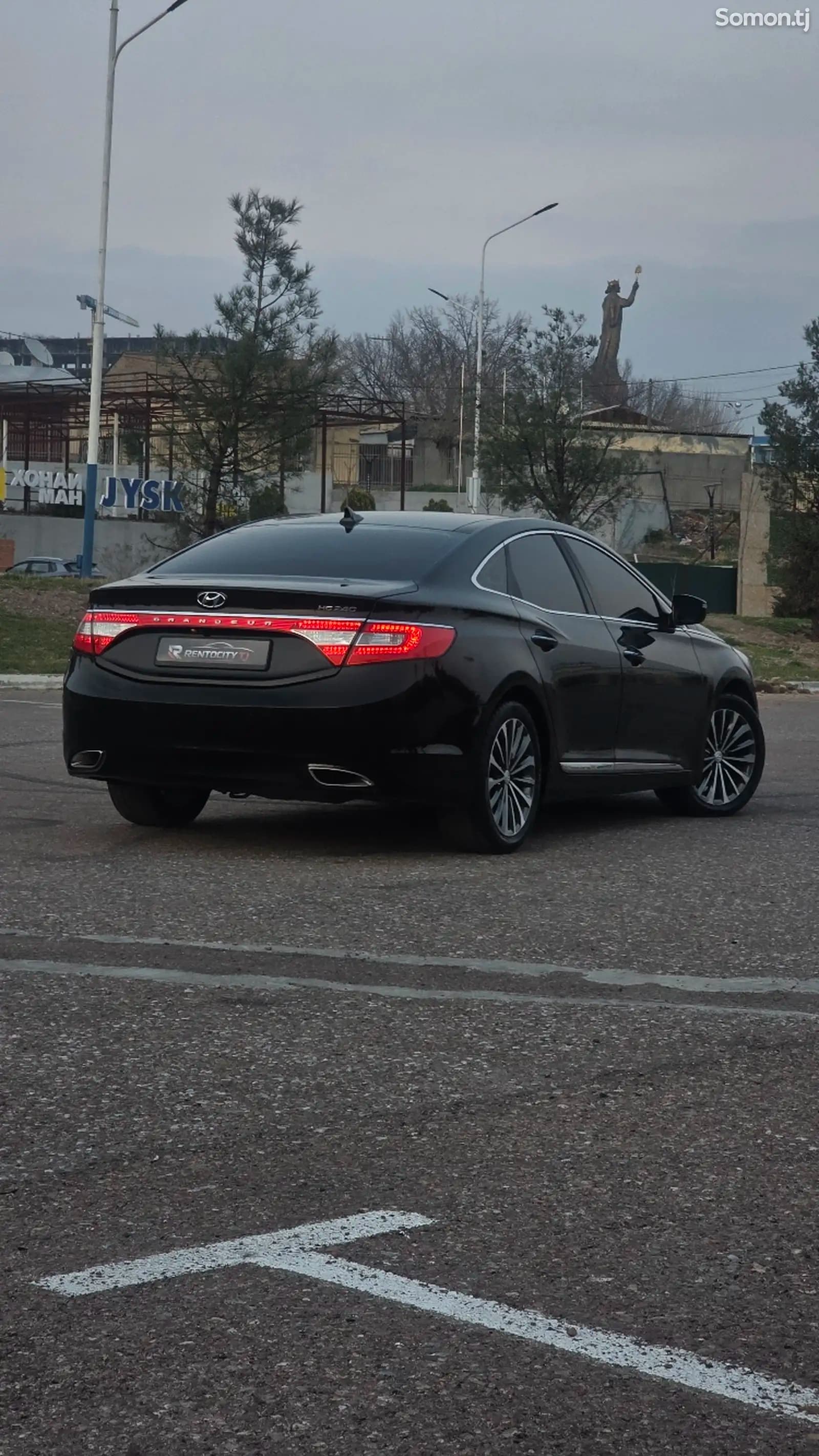 Аренда Hyundai Grandeur 2014 в Худжанде — вид сзади